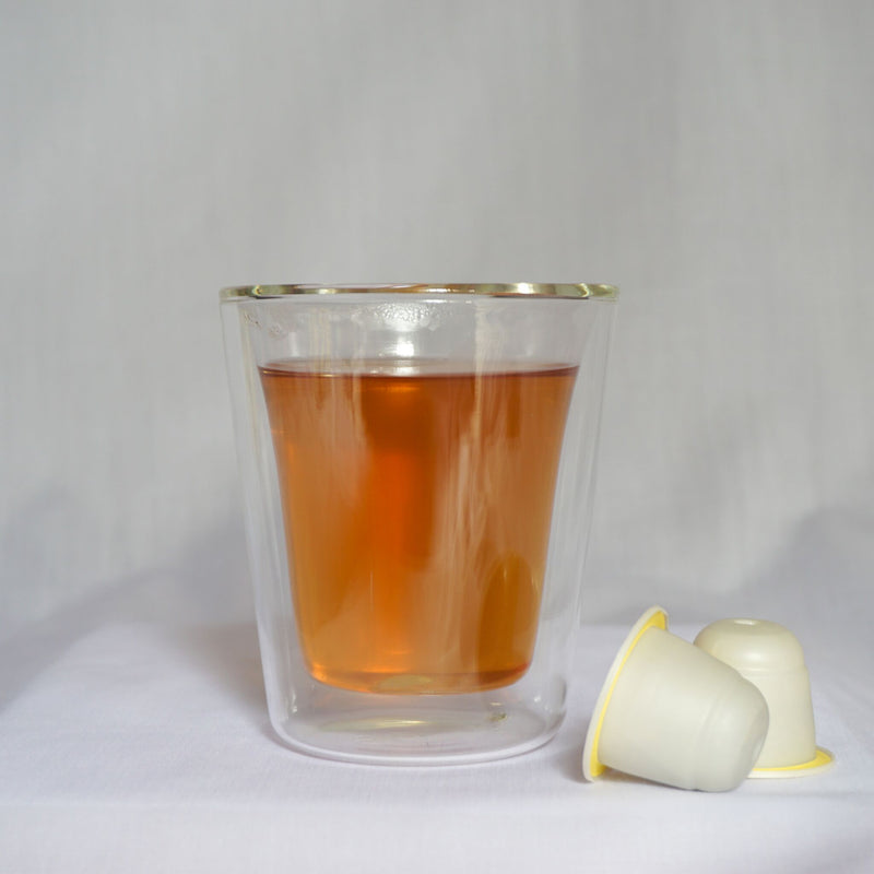 A cup of Thee's Empress Garden tea blend with Nespresso® compatible tea pods