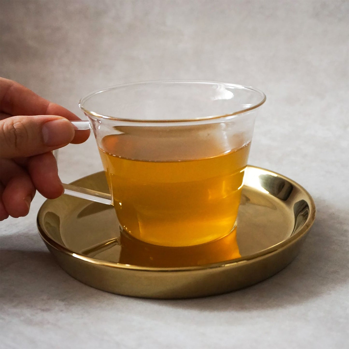 Clear Glass Tea Cup with Gold Saucer Set by THEE