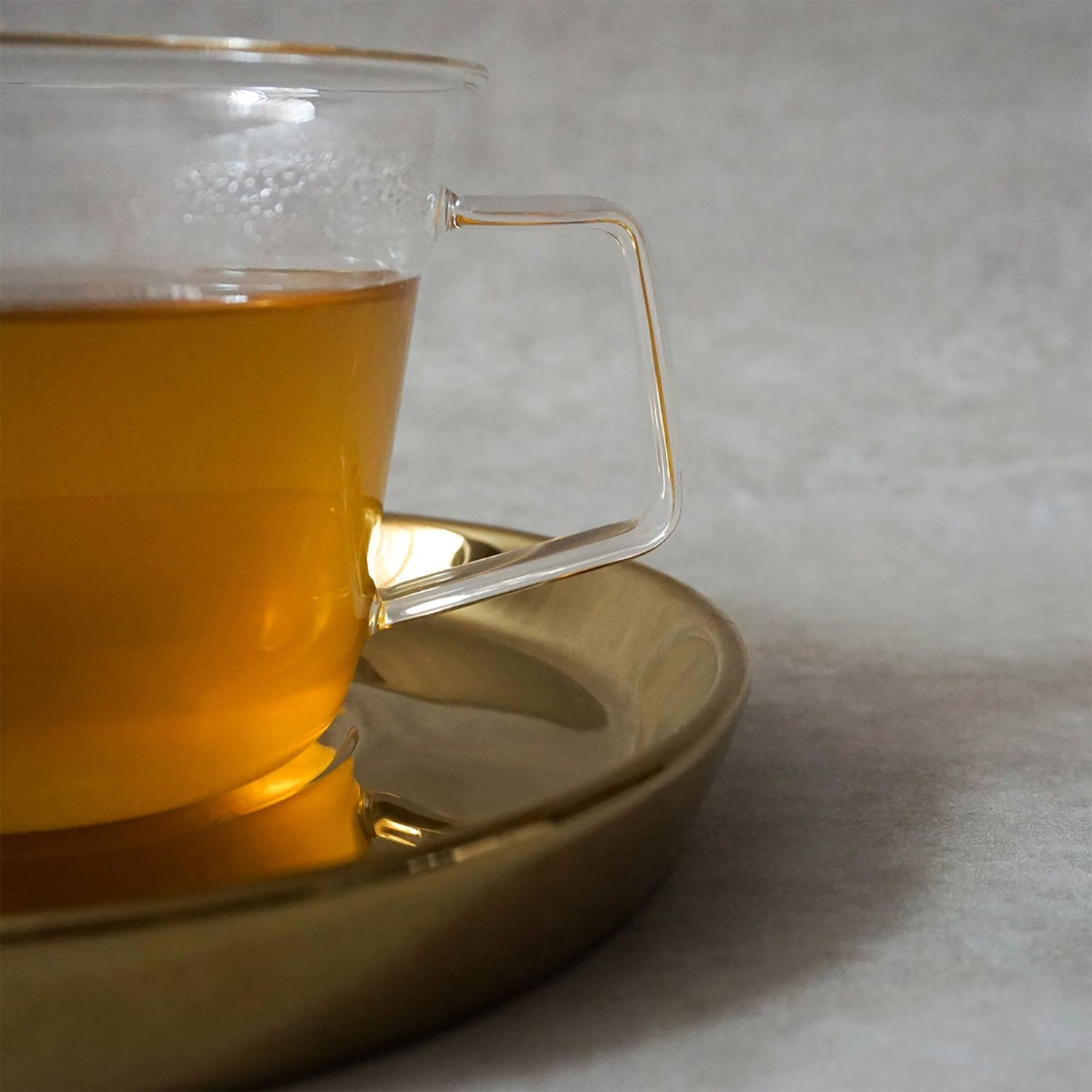 Clear Glass Tea Cup with Gold Saucer Set by THEE